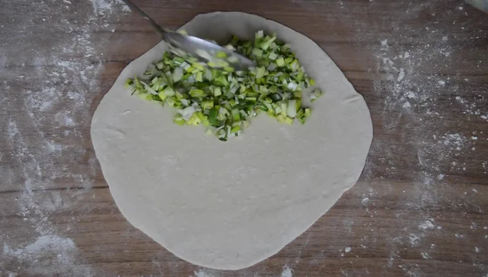Fill one half of each rolled-out dough with the leek and chive mixture. Fold over and press the edges to seal. (fill one half of it with the leak mixture and fold over the other half and then press down on the edges to seal)