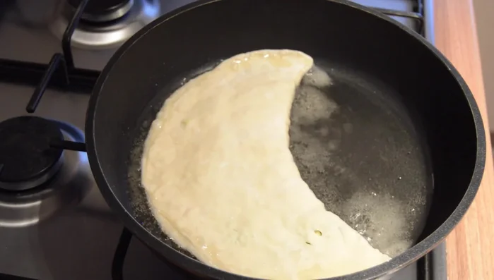 Heat oil in a frying pan. Fry each bolani for a few minutes per side until golden brown. (stop pouring some oil into your Frying Pan Once the oil has heated up place the bolog into into the frying pan fry each side for a few minutes until it's golden)