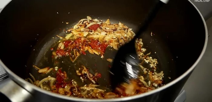 Lightly toast tomato paste before adding tomatoes. Mix well.