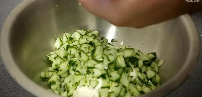 Prepare the yogurt cucumber sauce: Combine yogurt, thinly sliced cucumber (seeds removed), lemon juice, chopped coriander, garlic, black pepper, cumin, salt, and milk. Mix well.