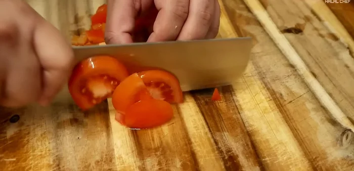 Evenly chop tomatoes and garlic cloves.