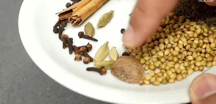 Blend black cumin seeds, coriander seeds, black pepper, cinnamon, green cardamoms, cloves, nutmeg, turmeric, salt, and optional paprika.