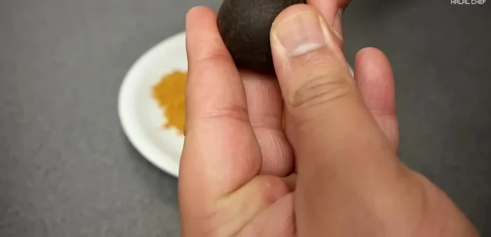 Add black lime to the spice mix and parse it with a knife to extract more flavor.