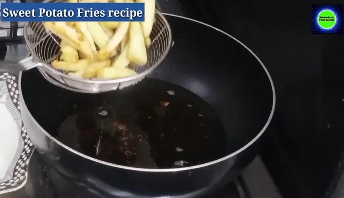 Season the fries with black pepper, crushed red chili powder, and lemon juice to taste.