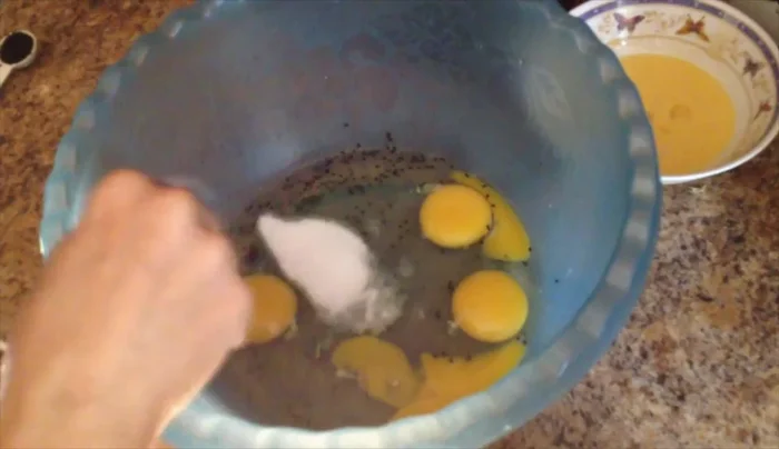 In a large bowl, combine 4 eggs, 1 tablespoon salt, and 1 teaspoon black seeds.