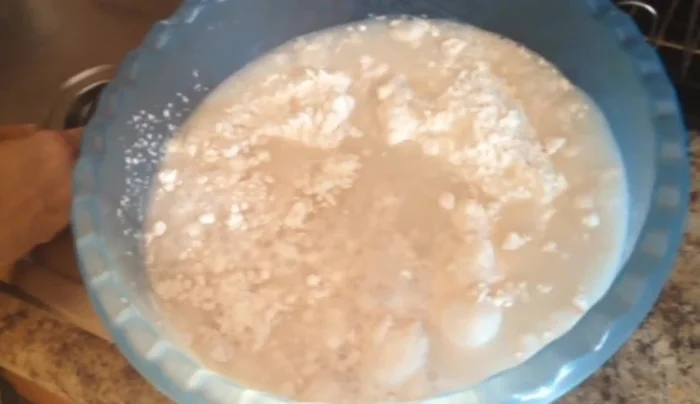 Gradually add 2 cups of warm water, mixing with your hands or a dough mixer until a dough forms. Add more water if needed to reach a thick consistency.