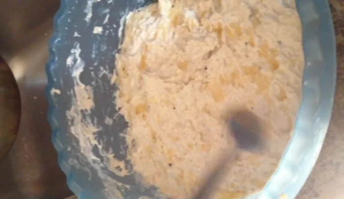Add 3 tablespoons of melted butter to the dough, mixing until moist and tender.