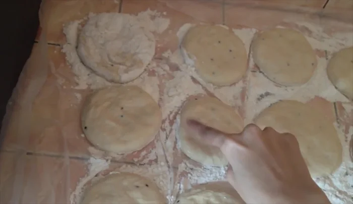 Flip each dough layer to coat with flour, making them easier to handle.