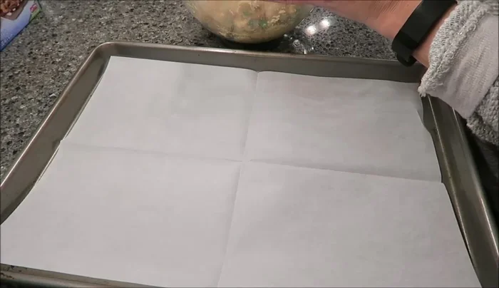 Place spoonfuls of cookie dough onto prepared baking sheets.