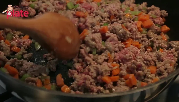 Add the mixed pork and veal, cook until browned, then add basil, a glass of water, and cook until most water evaporates (109.56).