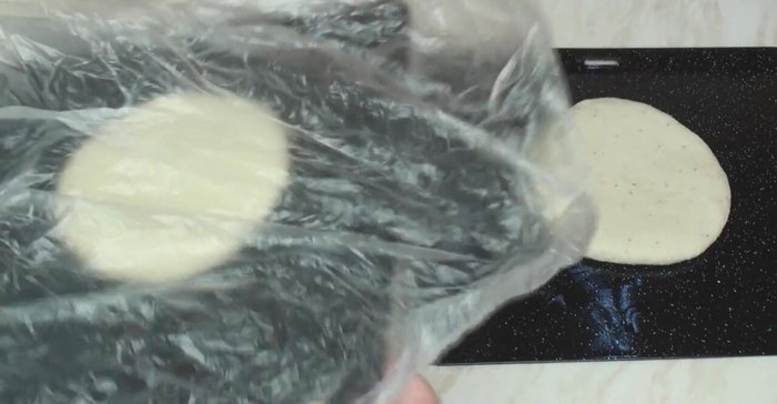 Cover the trays with plastic bags or oiled cloths and let them proof for 45 minutes.