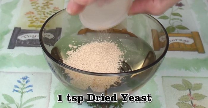 Add dried yeast to warm water, stir well, and let it stand for 10 minutes to activate.