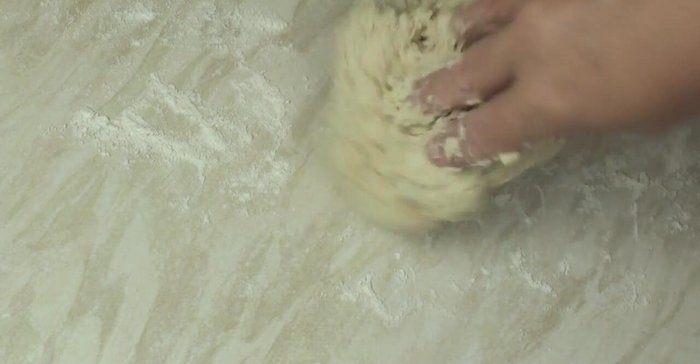 Turn the dough out onto a lightly floured surface and knead for 10 minutes until smooth and less sticky.