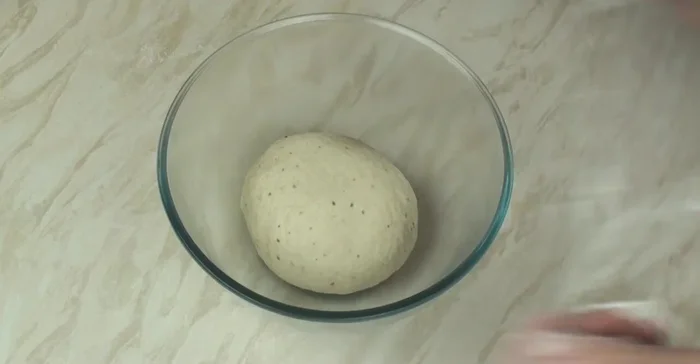 Place the dough in a lightly greased bowl, cover, and let it rise in a warm place until doubled in size.