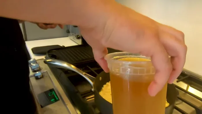 Pour in the homemade chicken stock and bring to a boil.