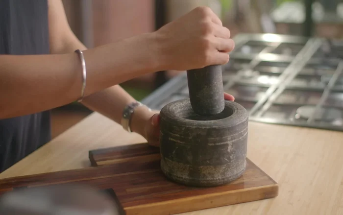 Grind spices: Coarsely grind cumin seeds, coriander seeds, and fennel seeds in a mortar and pestle.