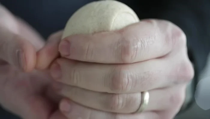 Form into balls: Shape each piece into a smooth ball. (310.83)