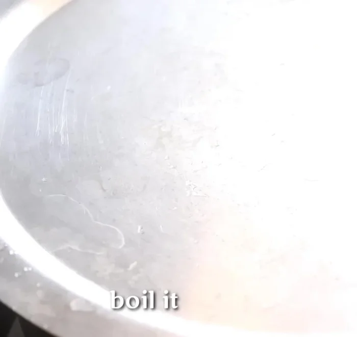 Cook the rice: Add the pre-soaked rice to the boiling mixture. Stir occasionally until the water is absorbed and the rice is cooked.