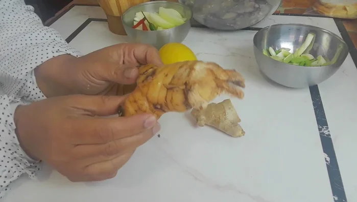 Prepare the aromatics: Dice onions, and prepare fresh garlic, ginger, galangal, and lemongrass root.