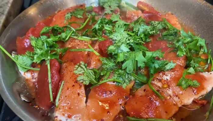 Bring to a boil, cover, and cook for about 15 minutes, basting the fish with the sauce occasionally.