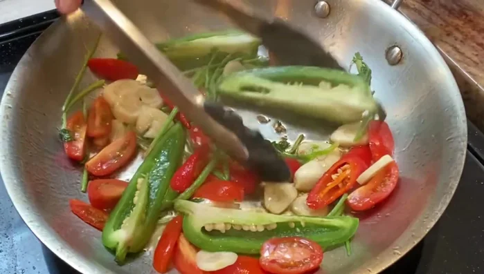 Sauté the vegetables for a few minutes.