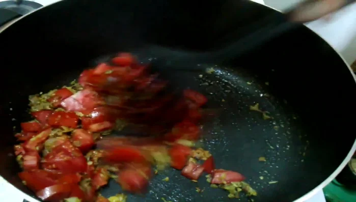 Add tomatoes, reduce heat, cover, and cook for 5 minutes until softened. Mash with the back of a spoon to thicken the stew.
