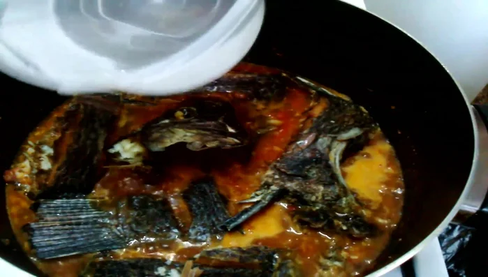 Add enough water to almost cover the tilapia, but not drown it. Simmer for 10 minutes to absorb flavors.