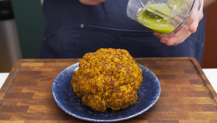 Dress cooked cauliflower with lemon chili dressing, let sit for 5 minutes. Transfer to serving plate.