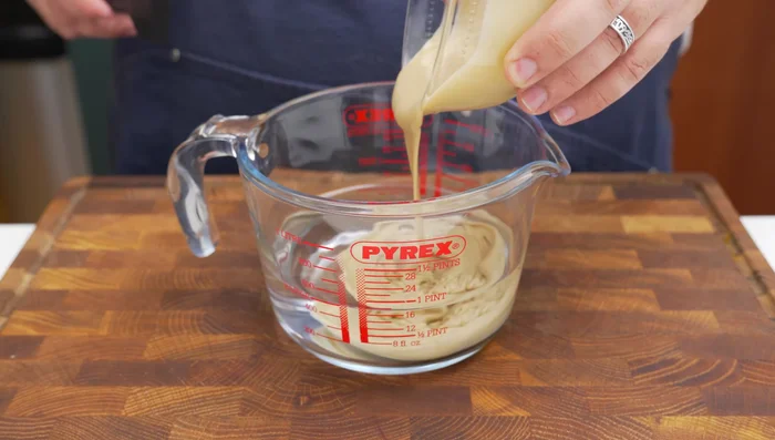 Make tahini sauce: Blend 400ml water, 120g tahini, 1/4 cup lemon juice, 3 minced garlic cloves, 1/2 tsp each of salt, black pepper, cayenne pepper, and 1/4 tsp cumin until smooth.