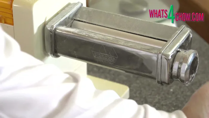 Cut the pastry into triangles. Transfer to a lightly greased baking sheet.