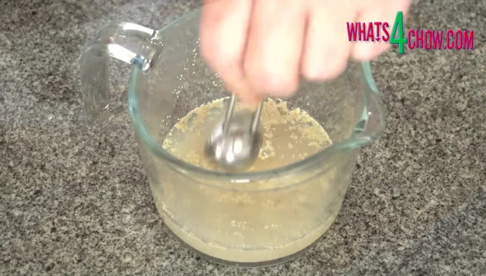 Combine yeast, warm water, and honey in a jug. Let it stand for 15 minutes until frothy.