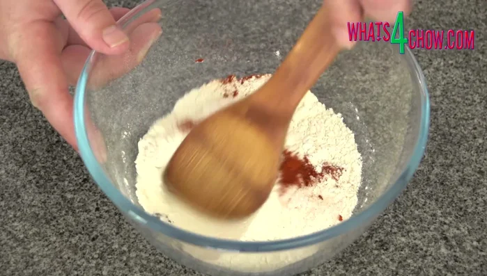 Combine flour, salt, ground hot paprika, and cayenne pepper in a mixing bowl.