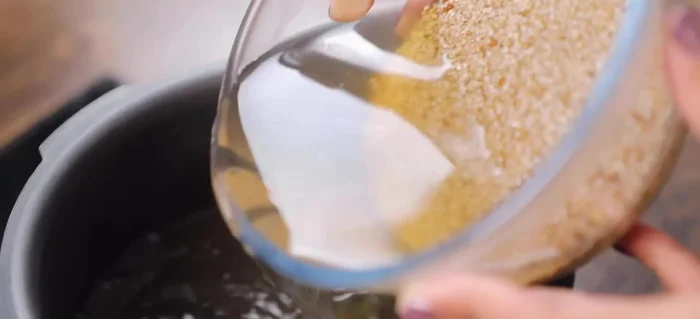 Cook the soaked millets in the same water using a pressure cooker. Add 1 teaspoon of salt and cook for 2-3 whistles.